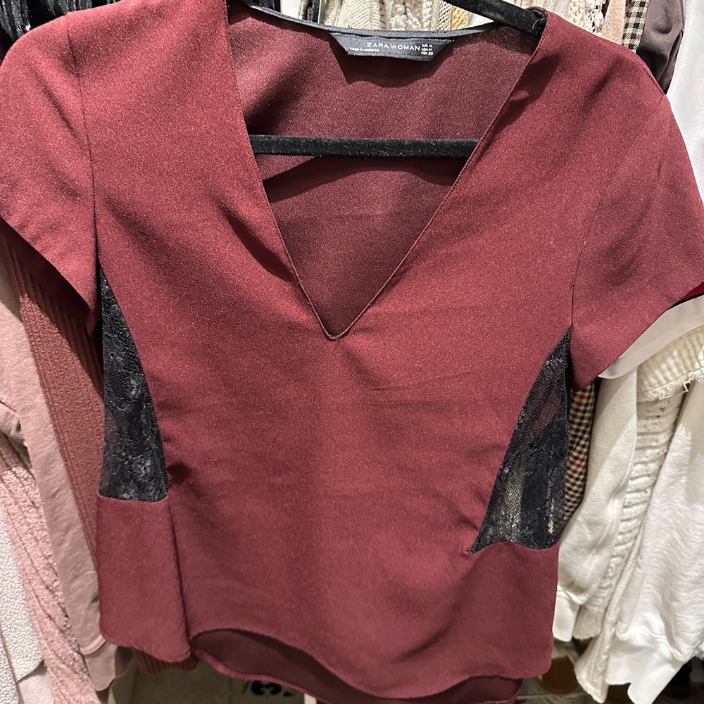 Burgundy crepe v-neck blouse with lace cutouts